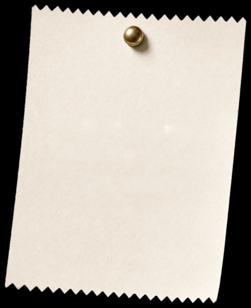 Étiquette en papier cranté épinglée au mur par une punaise laiton